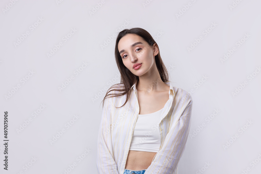 Portrait of a beautiful young woman thinking, isolated on white background Portrait of a beautiful young woman thinking, isolated on white background