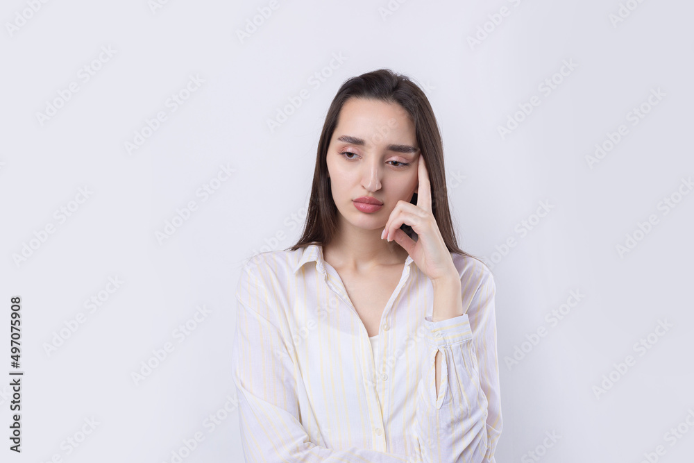 Portrait of a beautiful young woman thinking, isolated on white background Portrait of a beautiful young woman thinking, isolated on white background