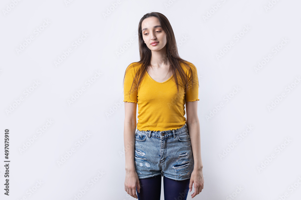 Portrait of a beautiful young woman thinking, isolated on concrete background Portrait of a beautiful young woman thinking, isolated on concrete background