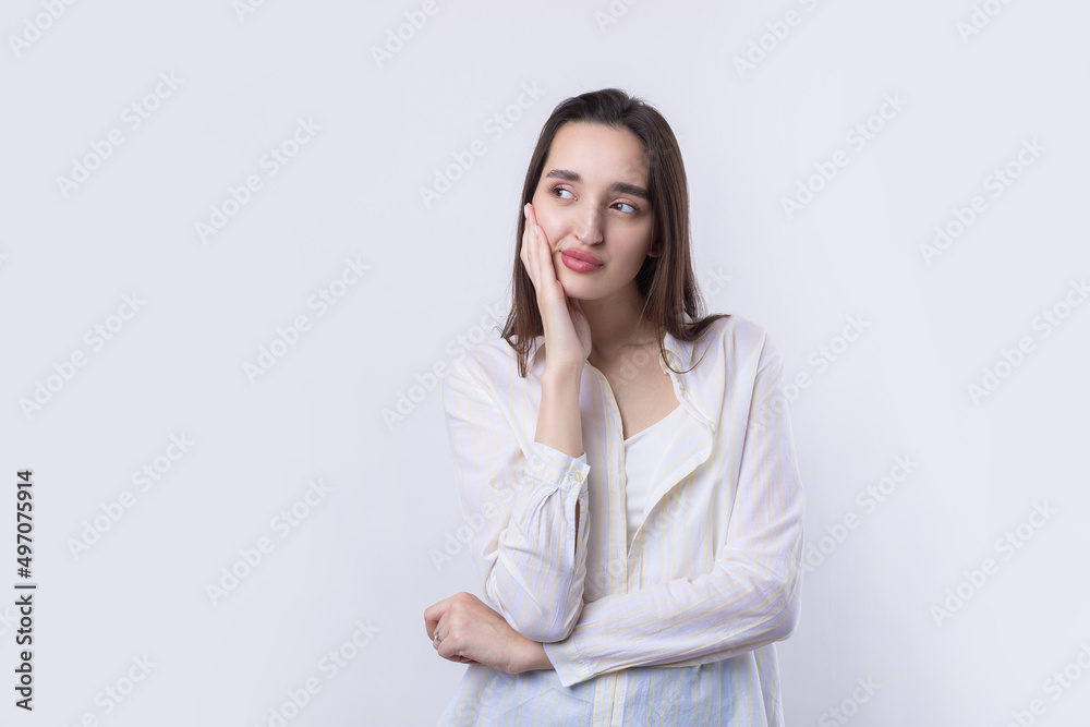 Portrait of a beautiful young woman thinking, isolated on white background Portrait of a beautiful young woman thinking, isolated on white background