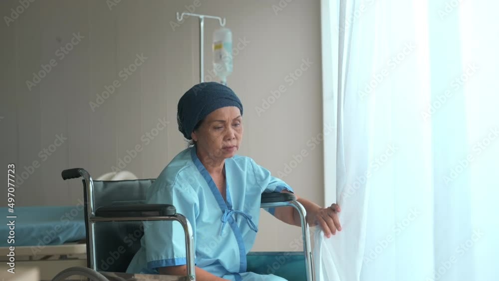 Cancer patient woman wearing head scarf and her supportive daughter in hospital, health and insurance concept Cancer patient woman wearing head scarf and her supportive daughter in hospital, health and insurance concept