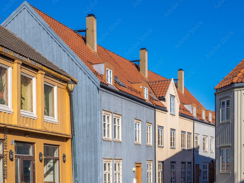 The streets behind the ancient warehouses flanking both sides of the Nidelva river in the old town of Trondheim, Trøndelag, Norway