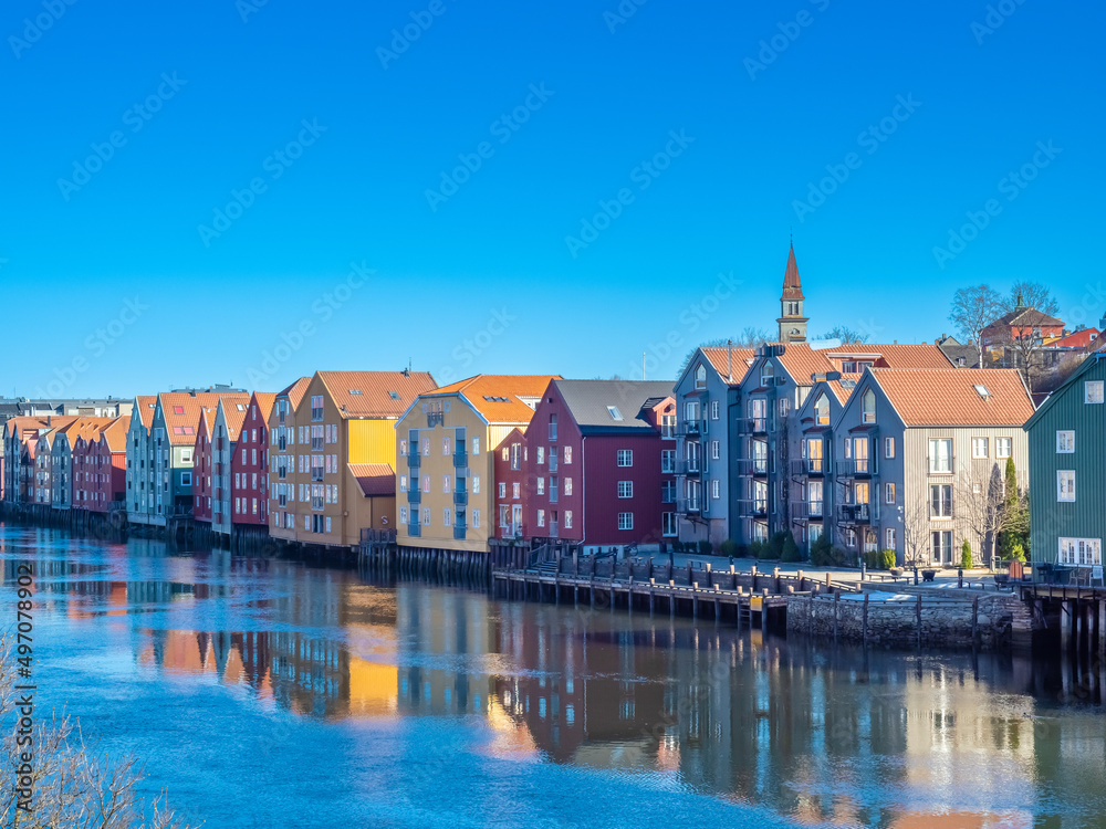 Scenes on the shores of the Nidelva river, with the old town bridge and the spire of the Nidaros Cathedral, Old town of Trondheim, Trøndelag, Norway