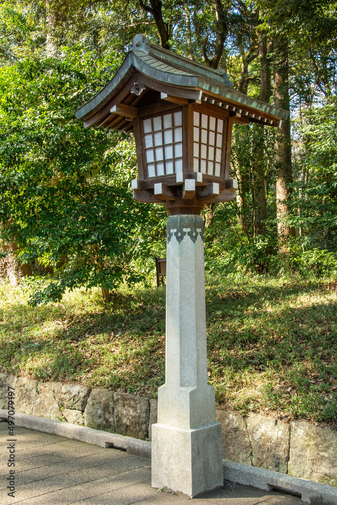 Japanese traditional lantern, called 'Toro' in a park on the way to a Shinto Shrine in Shibuya, Tokyo, Japan Japanese traditional lantern, called 'Toro' in a park on the way to a Shinto Shrine in Shibuya, Tokyo, Japan