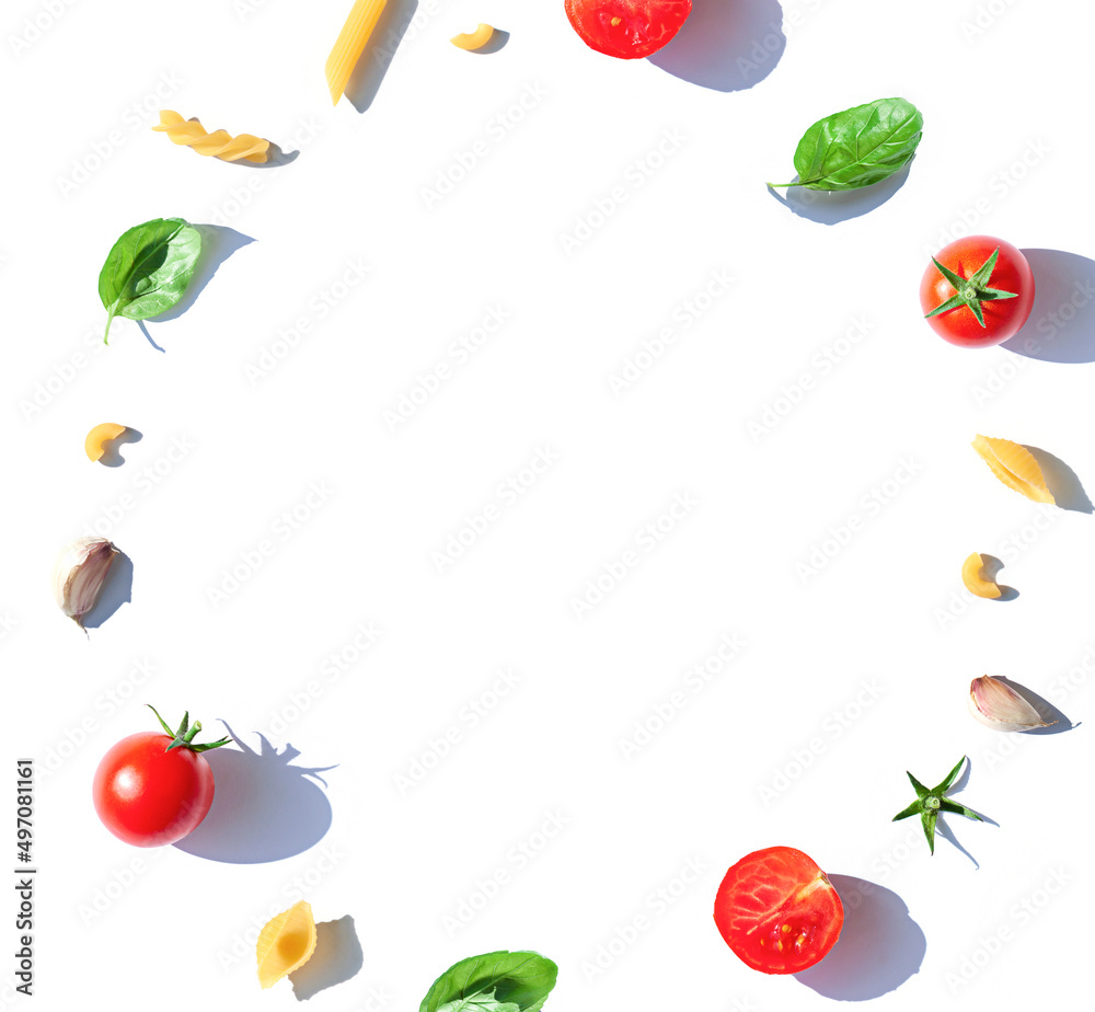 Italian pasta frame concept with tomatoes , fresh basil leaves and garlic. Food top view composition. Copy space Italian pasta frame concept with tomatoes , fresh basil leaves and garlic. Food top view composition. Copy space