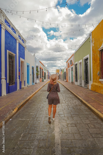 Female Tourist Walking along Streets of Campeche City in Mexico photo