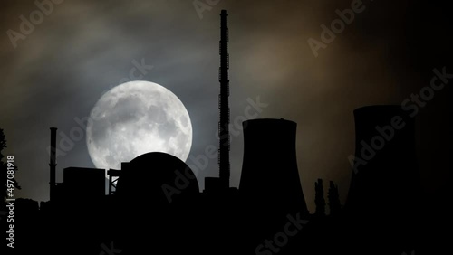 Philippsburg: Nuclear power station, Time Lapse by Night with Full Moon and Cooling towers in Silhouette, Germany photo