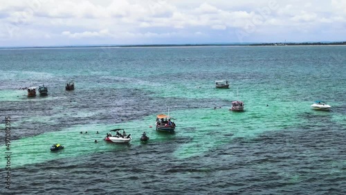 Aerial view of Natural Pools in Caramuanas Reef with Tourist Boats. Todos os Santos Bay, Brazil. Itaparica Island. photo