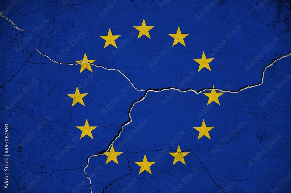 An image of the European Union flag on a wall with a crack. Background.