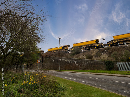 yellow truck on the railway line