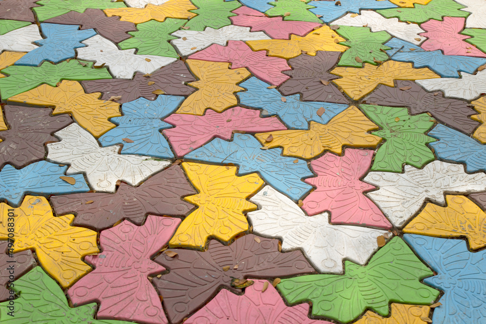 The multicolored walkway block ground with leaf litter and dirty. The multicolored walkway block ground with leaf litter and dirty.