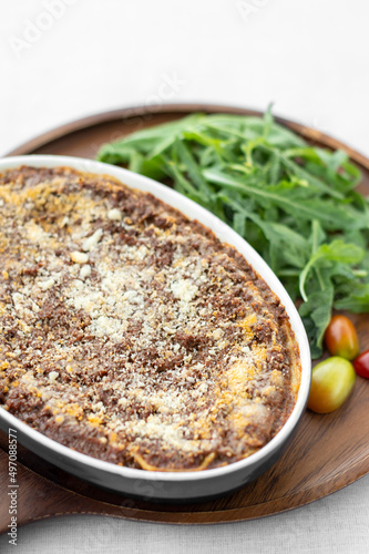 Photography fresh beef lasagna in oven dish on table in rome italy restaurant
