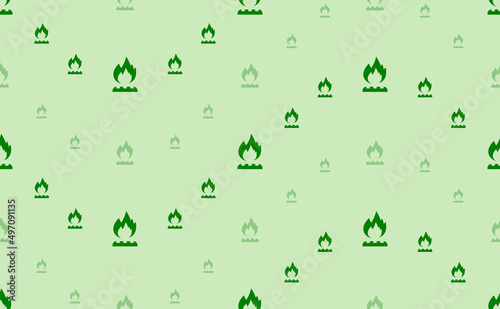 Seamless pattern of large and small green gas symbols. The elements are arranged in a wavy. Vector illustration on light green background