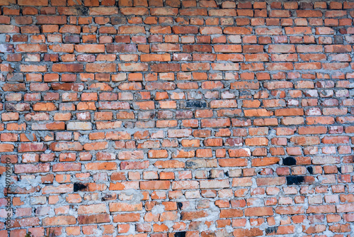 Red brick wall texture grunge background with vignetted corners to interior design