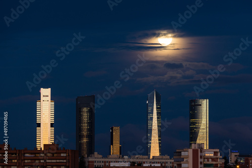 The moon over the four towers in the city of Madrid photo