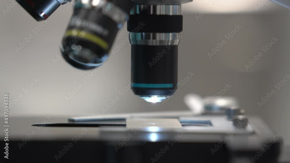 Microscope in laboratory. f Microscope with metal lens at laboratory. Scientific Equipment in a Research Laboratory. Microscope in laboratory. f Microscope with metal lens at laboratory. Scientific Equipment in a Research Laboratory.