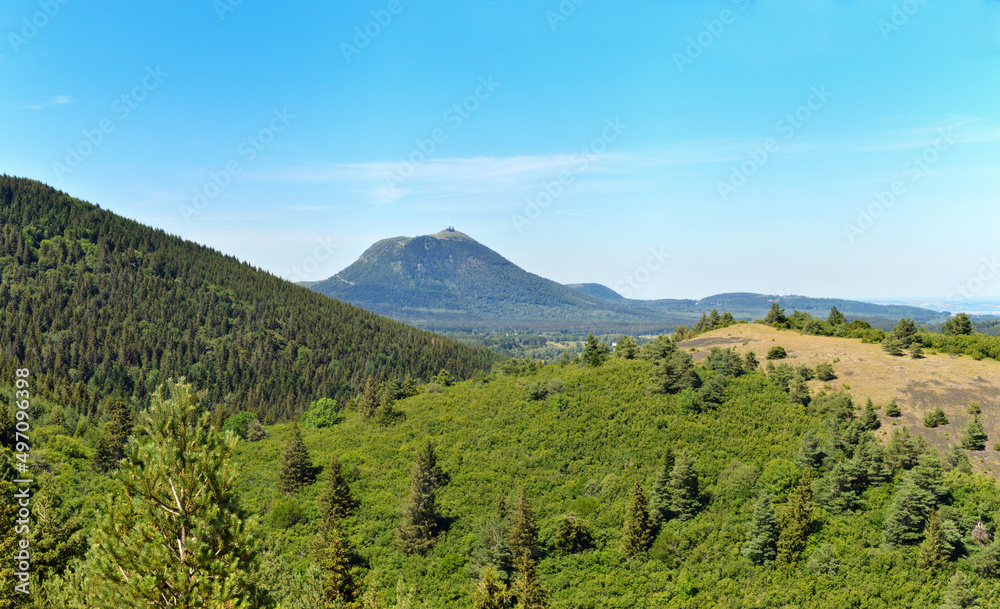 A beautiful volcanic mountain landscape with the puy de dome on the horizon.