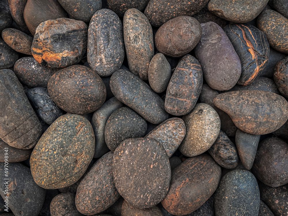 Brown round pebbles with strange patterns. Brown round pebbles with strange patterns.