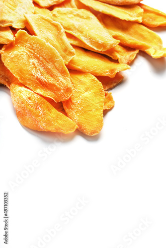 Dried mango sliced on a white background with free space