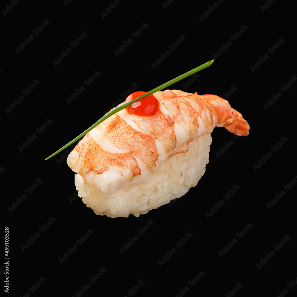 japanese nigiri sushi with tiger shrimp, sriracha sauce, chives. isolated on black background japanese nigiri sushi with tiger shrimp, sriracha sauce, chives. isolated on black background