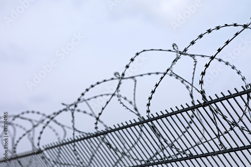 Fence metal with barbed wire