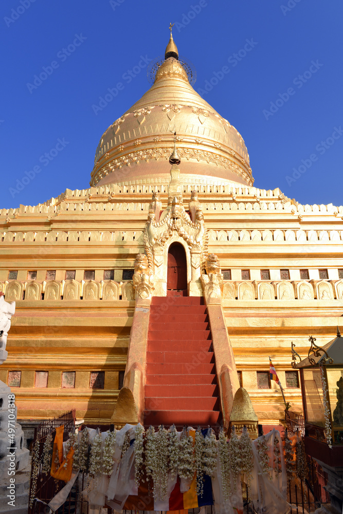 Entrance to the inner circle of Shwezigon Pagoda with altar in Nyaung-U, Bagan, Myanmar