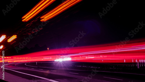 Night road lights. Lights of moving cars at night. long exposure red, blue, green