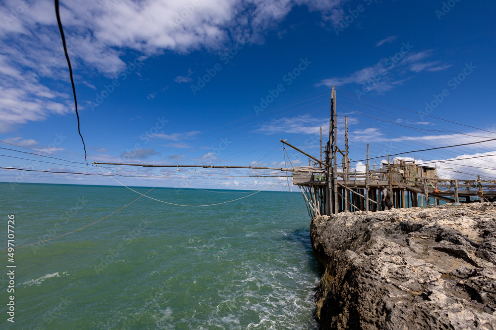 Trabucco, (Trabocco, Trebuchet) overlooking the Adriatic sea, a traditional Italian wooden fishing house. Stilt house for fishing on Apulian coast. Costa dei Trabocchi, Puglia (Apulia), Italy, Europe