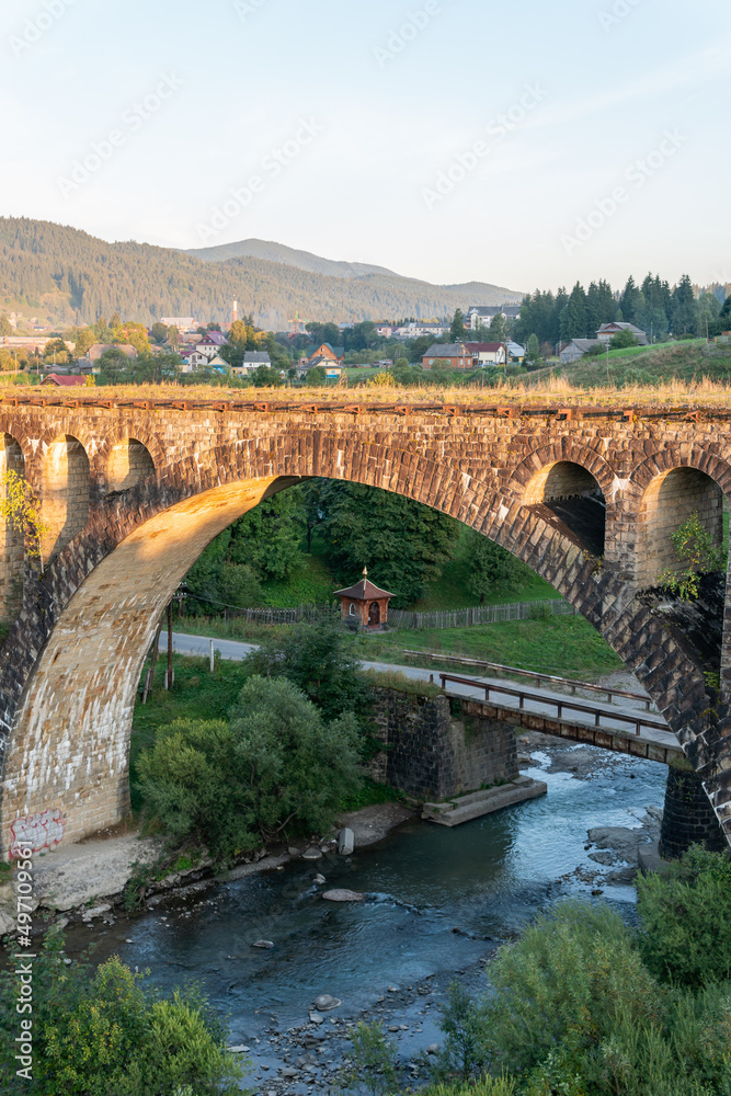 Vorokhta, Ukraine – September 24, 2021: A big, old, ancient aqueduct bridge in the mountains