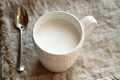 Probiotic kefir in a white cup on a table