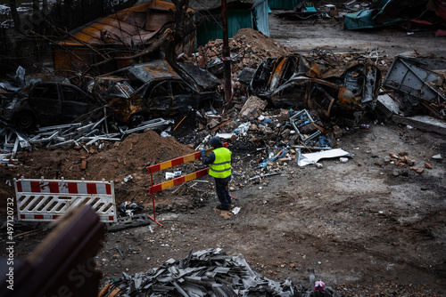 A worker puts up barriers near the explosion site