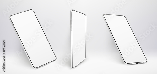 Three white realistic smartphones mockup. 3d mobile phones with blank white screens. Modern cell phones templates on white background