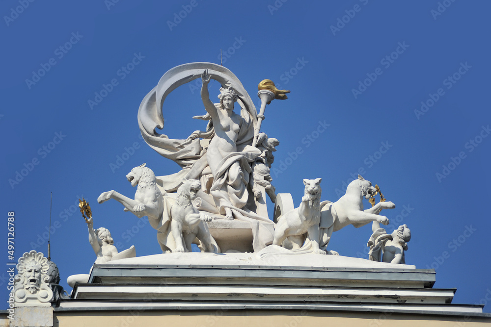 Statue of greek goddess Melpomene patroness of art in a chariot drawn