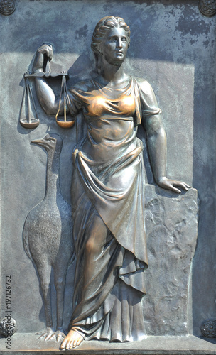 Fotografie Bronze high relief depiction of the goddess of justice Themis on the Monument to Duke Richelieu in Odesa, Ukraine