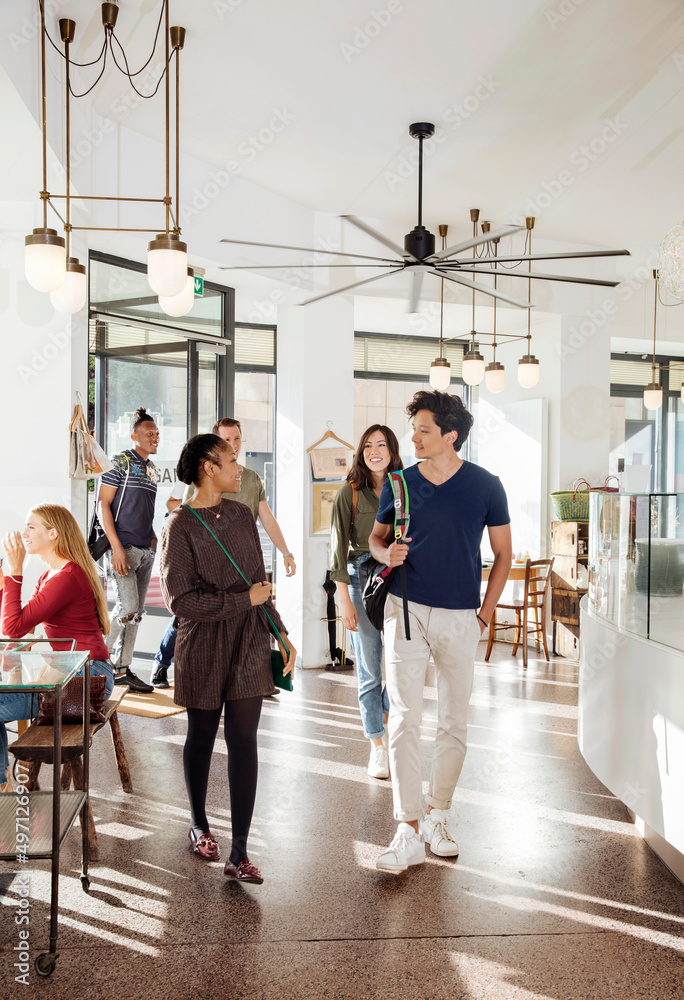 Group of friends entering restaurant