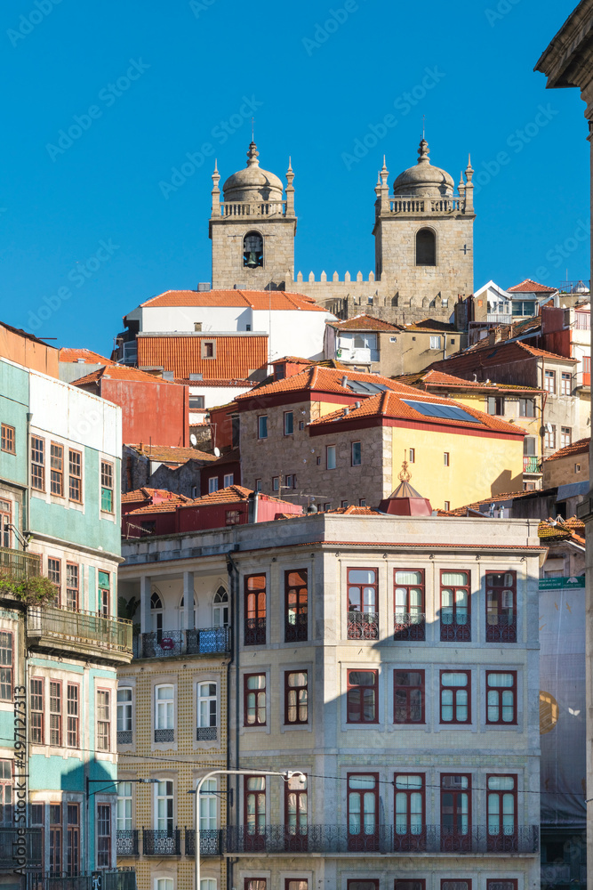 Portugal, Porto, Old town buildings with cathedral towers in background Portugal, Porto, Old town buildings with cathedral towers in background