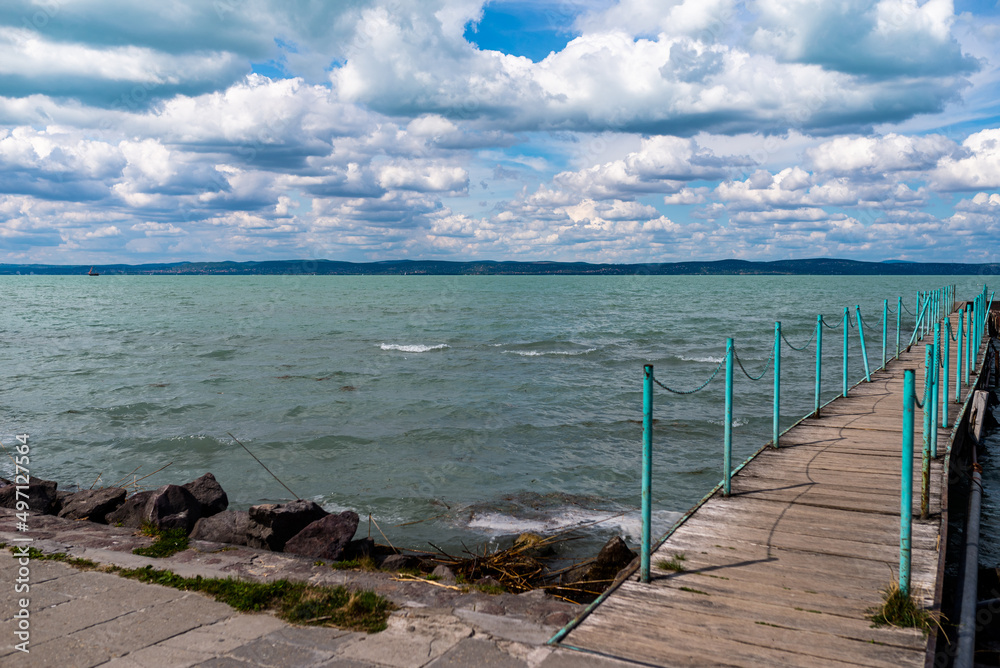 Balaton Lake in Siofok, Hungary. Dramatic Cloudy sky and blue, tourquise water.