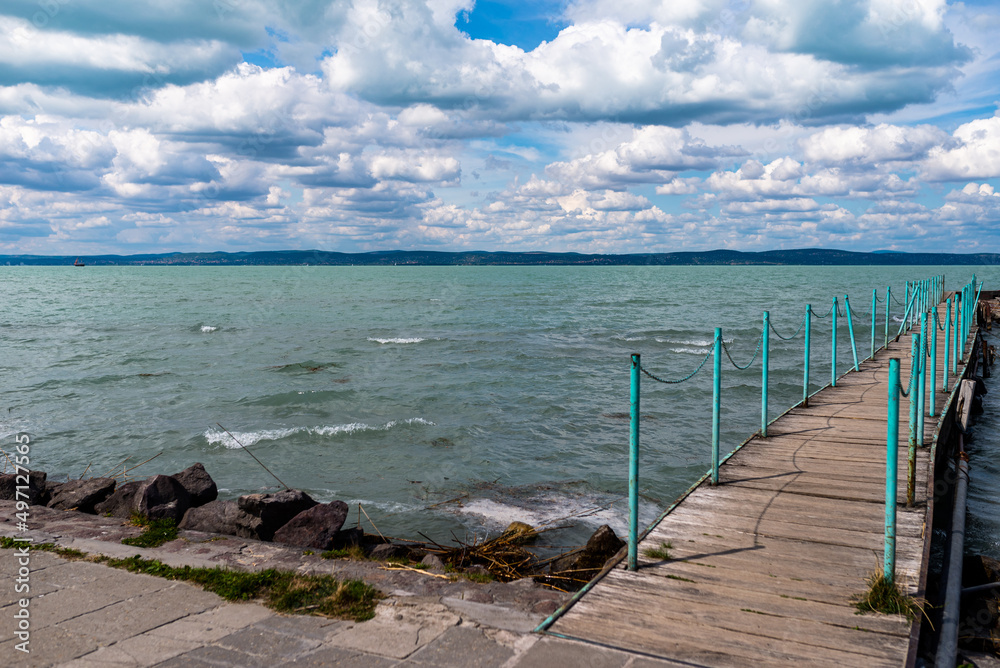 Fototapeta premium Balaton Lake in Siofok, Hungary. Dramatic Cloudy sky and blue, tourquise water.