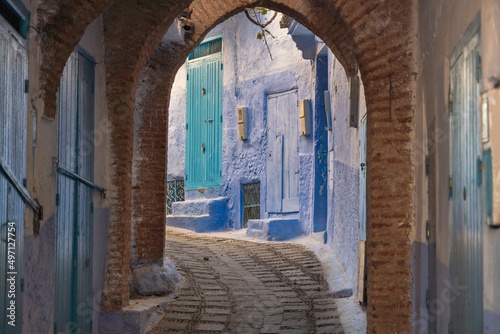 Morocco, Chefchaouen, Narrow alley and traditional blue houses photo