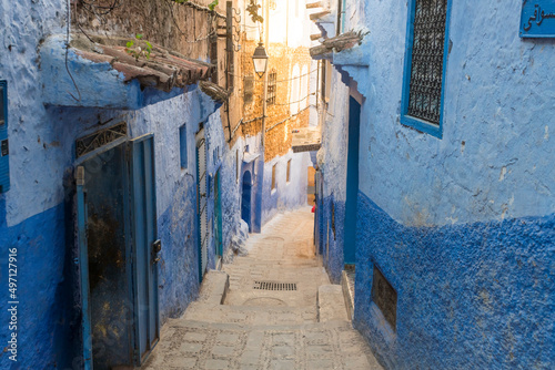 Morocco, Chefchaouen, Narrow alley and traditional blue houses photo