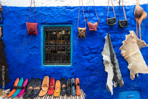 Morocco, Chefchaouen, Souvenirs for sale at traditional blue building © Image Source