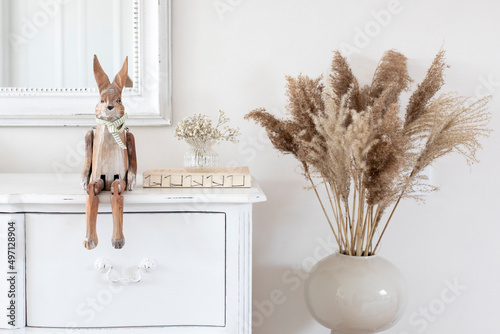 Wooden bunny and pampas grass home decor photo