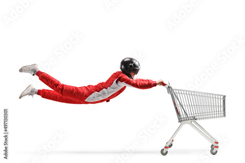 Car racer flying and holding a shopping cart © Ljupco Smokovski