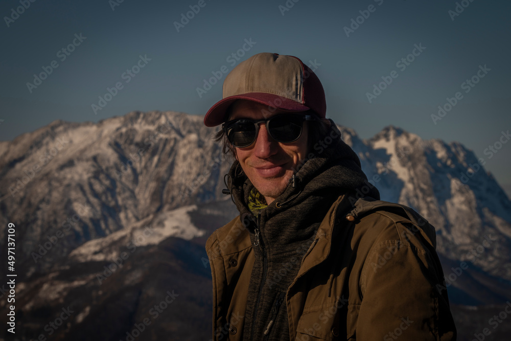 Cardada panoramic view over Maggiore blue lake in spring sunny morning with man
