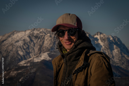 Cardada panoramic view over Maggiore blue lake in spring sunny morning with man