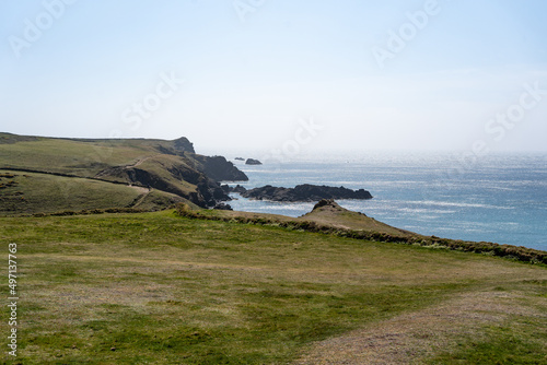 Cornwall coast with steep cliffs, beach and clear water in England, United Kingdom, beautiful hiking and biking trails for tourism and travel © Stanley Dullea