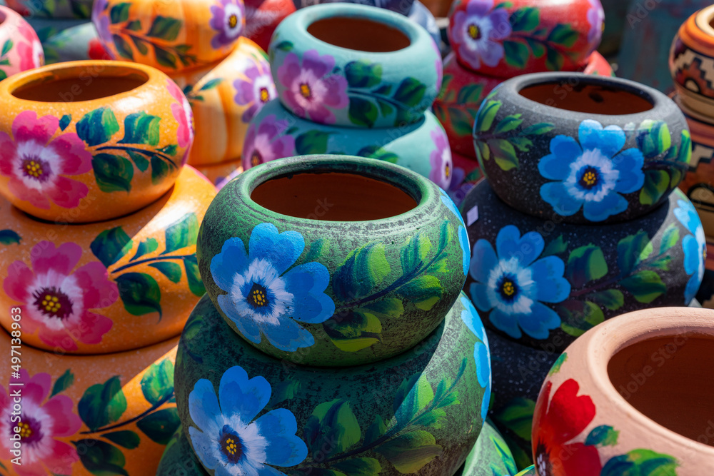 Variety of Colorfully Mexican Painted Ceramic Pots in an Outdoor Shopping Souvenir Market in Mexico.