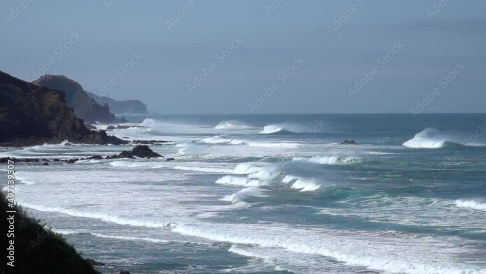 super slow motion shot of giant wave breaking at the beach coastline of portugal super slow motion shot of giant wave breaking at the beach coastline of portugal
