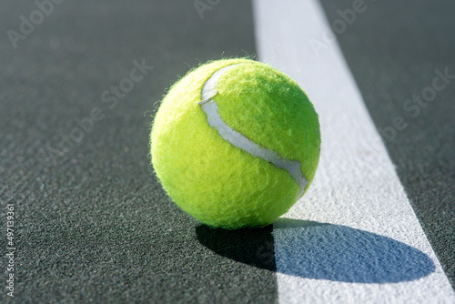 tennis ball on the court © Layn