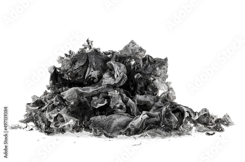 Pile of burnt paper isolated on a white background. The ashes of the paper. Charred paper scraps.